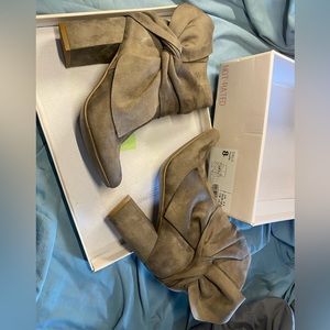 Tan boots with heels and bows